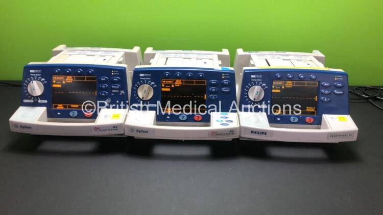 2 x Agilent Heartstream XL and 1 x Philips Heartstart XL Smart Biphasic Defibrillators with 1 x Pacer, 3 x ECG and 3 x Printer Options (All Power Up)