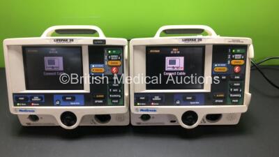 2 x Lifepak 20 Defibrillator / Monitors Including Pacer, ECG and Printer Options (Both Power Up with Service Lights)