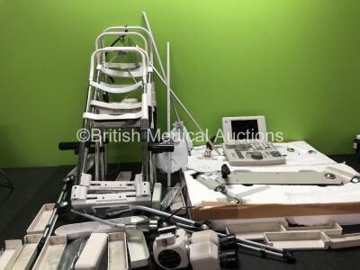 Ophthalmic Job Lot Including 2 x Wall Mounted Arms, 5 x Slit Lamp Chin Rests, 1 x Nidek Controller, 1 x Eye Piece Attachment , 2 x Light Arms and Approximately 12 x Chin Rest Rail Protectors *16094, 04040004*