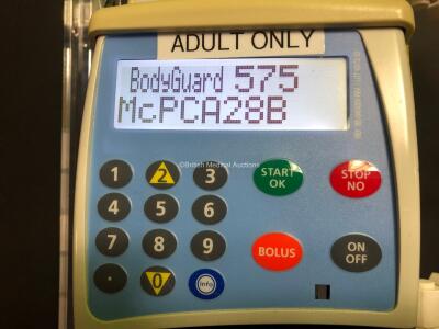 6 x CME McKinley Bodyguard 575 Infusion Pumps with 6 x Bases, 5 x Finger Controls and 6 x Boxes (All Power Up) - 3