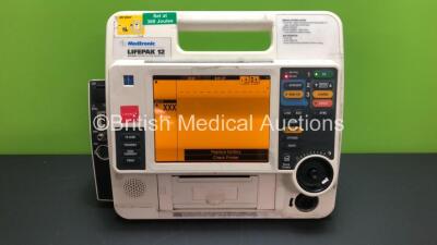 Medtronic Lifepak 12 Biphasic Defibrillator / Monitor Including ECG, NIBP and SpO2 Options *Mfd 2009* with Service Light on (Powers Up with Stock Battery, Battery Not Included)