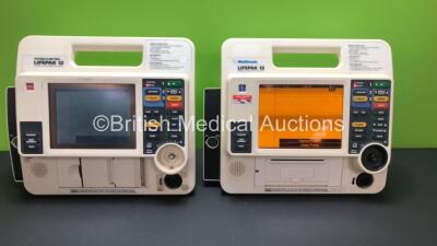 2 x Medtronic Lifepak 12 Biphasic Defibrillator / Monitors Including ECG Option *Mfd 2007 - 1999* with 1 x Missing Dial and 2 x Service Lights on (Both Power Up with Stock Battery, Battery Not Included)