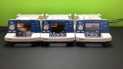 3 x Philips HeartStart XL Smart Biphasic Defibrillators with ECG and Printer Options (All Power Up When Plugged In)