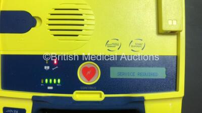 4 x Cardiac Science Powerheart AED G3 Automated External Defibrillators (All Power Up with 3 x Service Lights and 1 x Faulty Display) and 2 x Cardiac Science AED Trainers (1 x No Power and Damaged Cover - See Photos) - 3