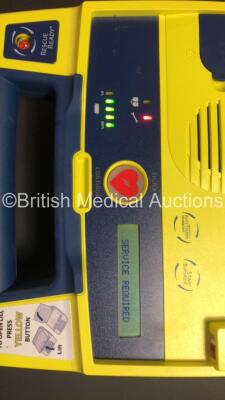 4 x Cardiac Science Powerheart AED G3 Automated External Defibrillators (All Power Up with 3 x Service Lights and 1 x Faulty Display) and 2 x Cardiac Science AED Trainers (1 x No Power and Damaged Cover - See Photos) - 5