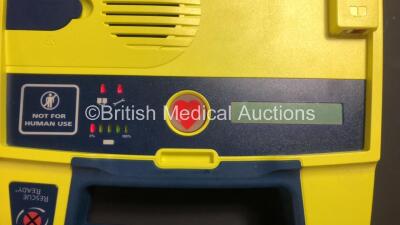 4 x Cardiac Science Powerheart AED G3 Automated External Defibrillators (All Power Up with 3 x Service Lights and 1 x Faulty Display) and 2 x Cardiac Science AED Trainers (1 x No Power and Damaged Cover - See Photos) - 6