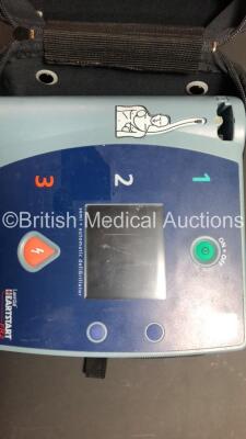 1 x Laerdal HeartStart FR2+ Defibrillator (Powers Up with Stock Battery - Not Included) and 1 x Laerdal HeartStart FR2 Defibrillator (No Power) with 2 x Carry Cases - 3