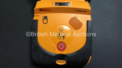 Job Lot Including 1 x Medtronic Lifepak CR Plus Defibrillator *Mfd 2011* (Powers Up) 1 x Zoll AED Pro Defibrillator (Damaged Screen and Untested Due to Missing Battery) and 1 x HeartSine SAM 300P Samaritan PAD Defibrillator (Untested Due to Missing Batter - 2