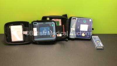 1 x Philips Heartstart FR2+ Defibrillator in Carry Case with 2 x Batteries *Install Dates 11-2021 - 06-2024* (Powers Up and Passes Self Test) and 1 x Philips FRX Defibrillator in Case (Untested Due to Missing Battery) *B13G-04449 - 0405148894*