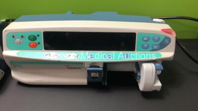 Job Lot Including 2 x Alaris PK Syringe Pumps (1 x Carefusion, 1 x Cardinal Health) and 2 x Alaris GH Syringe Pumps (1 x Carefusion, 1 x Cardinal Health) All Draw Power with 2 x Service Required and 2 x Alarms *18166 - 24530 - 800247840 - 800504938* - 2