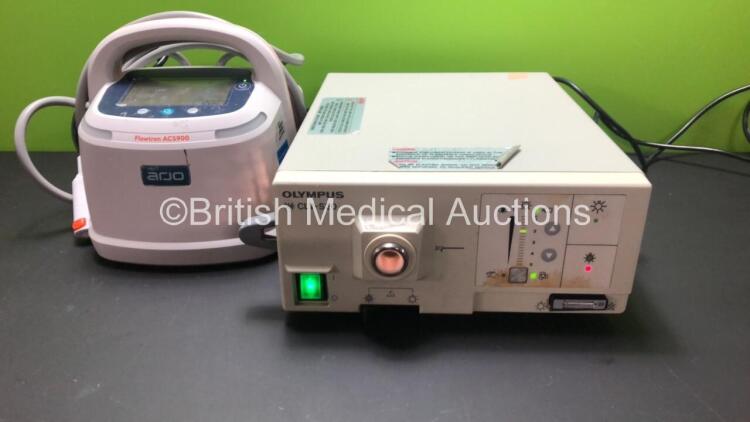 Mixed Lot Including 1 x Olympus CLV-S20 Light Source, 1 x Arjo Flowtron ACS900 Leg Pressure Therapy Unit *Mfd 2018* (Both Power Up)