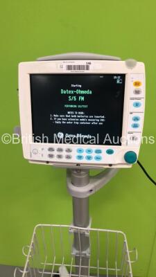 GE Datex-Ohmeda F-FM-00 Patient Monitor on Stand with 1 x E-PSMP-01 Module with NIBP,P1/P2,T1/T2,SpO2 and ECG Options * Mfd 2013 * and 1 x N-FC-00 Gas Module with Mini D-Fend Water Trap * Mfd 2009 * (Powers Up) * SN 6945220 / 6492421 / 6179277 * - 2