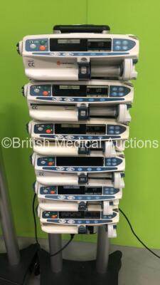 2 x Alaris Asena Docking Stations with 8 x Carefusion Alaris CC Syringe Pumps and 4 x Cardinal Health Alaris CC Syringe Pumps (All Power Up) - 2