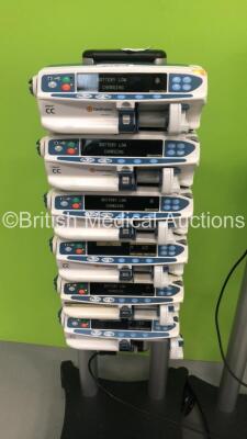 2 x Alaris Asena Docking Stations with 8 x Carefusion Alaris CC Syringe Pumps and 4 x Cardinal Health Alaris CC Syringe Pumps (All Power Up) - 3