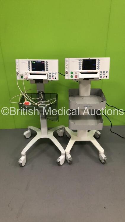 2 x Huntleigh Sonicaid FM800 Encore Fetal Monitors on Stands with 2 x Transducers (Both Power Up - 1 x Crack in Casing - See Pictures)