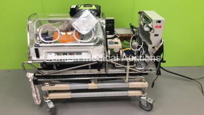 Drager Air-Shields Isolette TI500 Transport Incubator (Powers Up) with Smiths Medical Babypac 100 Ventilator, Alaris Asena GH MK III Syringe Pump, Zoll AED Pro Defibrillator with Battery (Powers Up), Datex-Ohmeda 5120 Oxygen Monitor and Accessories