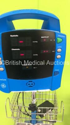 3 x GE Dinamap Pro 400V2 Patient Monitors on Stands with 2 x BP Hoses,3 x BP Cuffs and 1 x SpO2 Finger Sensor and 1 x GE ProCare Patient Monitor on Stand (All Power Up-1 x Missing Dial and Side Panel-See Photos) * SN AAW06500225SA / AAX071003SA / AAX07420 - 2