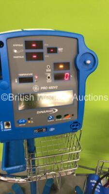 3 x GE Dinamap Pro 400V2 Patient Monitors on Stands with 2 x BP Hoses,3 x BP Cuffs and 1 x SpO2 Finger Sensor and 1 x GE ProCare Patient Monitor on Stand (All Power Up-1 x Missing Dial and Side Panel-See Photos) * SN AAW06500225SA / AAX071003SA / AAX07420 - 3