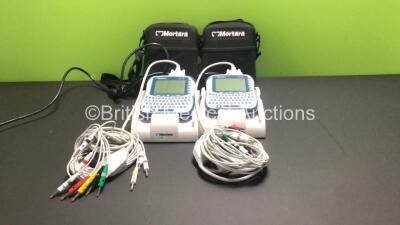 2 x Mortara ELI 10 Handheld ECG Machines with 10 Lead ECG Leads and Docking Stations in Cases (Both Docking Stations Power Up, 1 x ECG Machine Powers Up, 1 x No Power)