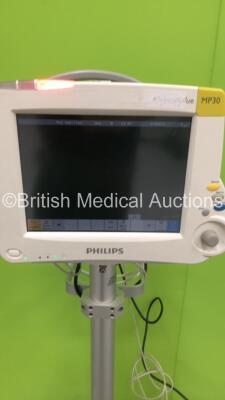 Philips IntelliVue MP30 Patient Monitor on Stand with 1 x Philips M3001A Module with Press,Temp,NBP,SpO2 and ECG Options * Mfd 2011 - See Attached Photos for Module *,1 x NBP Lead and 1 x ECG Lead (Powers Up) * SN DE72856386 / DE907T2822 * Mfd 2008 * - 2