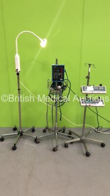 Mixed Lot Including 1 x Critikon Dinamap Vital Signs 8100T Patient Monitor on Stand with 1 x BP Hose, 1 x Brandon Medical Patient Examination Light on Stand and 2 x Graseby 3100 Syringe Pumps on Stand (All Power Up) * SN 38331 / 17623/1 *