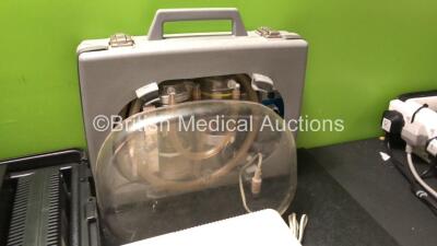 Mixed Lot Including 2 x Neuro Control Ref 1674 Power Supplies in Carry Cases (Both Power Up) 1 x Philips Respironics Porta-Neb Nebulizer (Powers Up) 1 x Laerdal Suction Unit with 1 x DC Power Supply (Untested) - 3