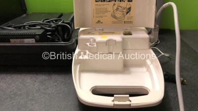 Mixed Lot Including 2 x Neuro Control Ref 1674 Power Supplies in Carry Cases (Both Power Up) 1 x Philips Respironics Porta-Neb Nebulizer (Powers Up) 1 x Laerdal Suction Unit with 1 x DC Power Supply (Untested) - 4