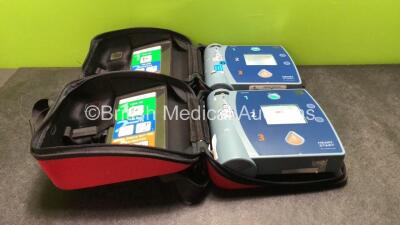 2 x Philips Heartstart FR2+Defibrillators in Carry Cases (Both Power Up when Tested with Stock Batteries-Batteries Not Included) *SN 0207223226, 0207223348*