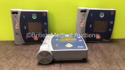 Job Lot Including 1 x Philips FR2+ Heartstart Defibrillator (Powers Up and Fails Self Test-Battery Not Included) 2 x Laerdal Heartstart FR2 Defibrillators (1 No Power, 1 Powers Up and Passes Self Test-Batteries Not Included)