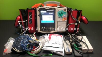 Philips Heartstart MRx Defibrillator Including ECG, CO2, NIBP, SpO2 and Printer Options *Mfd 2010* with Side Bags Containing 3 x M3538A Batteries, 1 x ECG Lead, 1 x SpO2 Lead, 1 x BP Lead with Cuff, 1 x Paddle Lead with Test Load, 1 x Laerdal Q-CPR Meter 