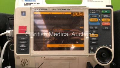 Medtronic Lifepak 12 Biphasic Defibrillator Including ECG, SpO2, NIBP, CO2 and Printer Options with 2 x Lifepak NiCd Batteries, 1 x NIBP Hose, 1 x BP Cuff, 1 x SpO2 Finger Sensor and 1 x Paddle Lead (Powers Up) *SN 37620264* - 2