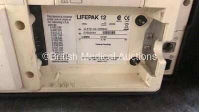 Medtronic Lifepak 12 Biphasic Defibrillator Including ECG, SpO2, NIBP, CO2 and Printer Options with 2 x Lifepak NiCd Batteries, 1 x NIBP Hose, 1 x BP Cuff, 1 x SpO2 Finger Sensor and 1 x Paddle Lead (Powers Up) *SN 37620264* - 6