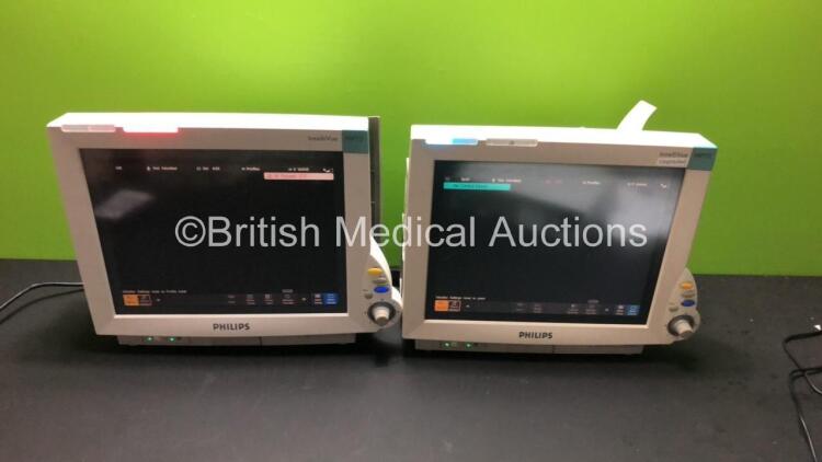 2 x Philips IntelliVue MP70 Patient Monitors (Both Power Up-1 x Damage to Casing-See Photos) * Mfd 2009 / 2005 *