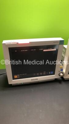 2 x Philips IntelliVue MP70 Patient Monitors (Both Power Up-1 x Damage to Casing-See Photos) * Mfd 2009 / 2005 * - 2