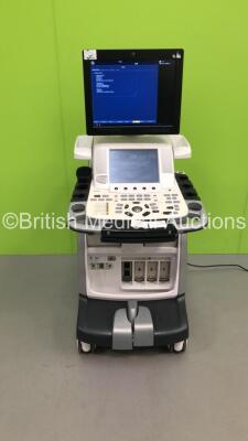 GE Vivid E9 Flat Screen Ultrasound Scanner *S/N VE94278* **Mfd 11/2012** Application Software Version 113 System Software Version 104.3.6 with Sony UP-D897 Digital Graphic Printer (Powers Up - Missing Dials / Damage to Machine / Loose Keyboard - See Pictu