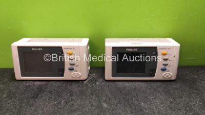 2 x Philips Intellivue 2 Hand Held Patient Monitors Software Versions H.15.41, H.15.51, Including ECG, SpO2, NBP, Press and Temp Options with 2 x Batteries (Both Power Up when Tested with Stock Batteries- Batteries Included No Power) *SN DE03797369, DE575