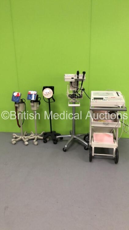 1 x Agilent PageWriter 200 ECG Machine on Stand with 10 Lead ECG Leads, 1 x Welch Allyn Otoscope / Ophthalmoscope Set on Stand with 2 x Handpieces and 1 x Head (See Pictures) and 3 x Blood Pressure Meters on Stands