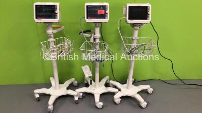 2 x Philips SureSigns VM4 Patient Monitors with ECG,SpO2 and NIBP Options on Stands with 2 x SpO2 Finger Sensors and 2 x BP Hoses and 1 x Philips SureSigns VM6 Patient Monitor with ECG,SpO2 and NIBP Options with 1 x BP Hose and 1 x ECG Lead (2 x Power Up,