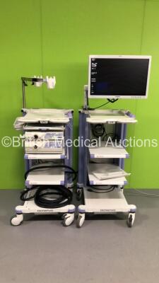 2 x Olympus Stack Trolleys Including Olympus OEV261H Monitor,Olympus Evis Lucera CV-260SL Processor,Olympus Evis Lucera CLV-260SL Light Source/Processor,Olympus Keyboard and Olympus Stack Connector Cables (Powers Up) * SN 7350317 / 7342632 / 7338876 *