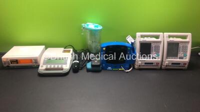 Mixed Lot Including 1 x BladderScan BVI 300 with Probe (Powers Up) 1 x GE CareScape Dinamap V100 with Power Supply (Powers Up) 1 x Datex Ohmeda 3900 Oximeter, 2 x Baxter Infusion Pumps, 1 x Serres Cup and 1 x Mastech MS6610 Luxmeter *76877 - SH614130530SA
