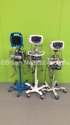 2 x Welch Allyn 53NT0 Vital Signs Monitors on Stands with SPO2 Finger Sensors, BP Hoses and Cuffs and 1 x GE Dinamap ProCare Auscultatory 100 Vital Signs Monitor on Stand with BP Hose (Powers Up) *S/N DPC121X-EN1 / JA091608 / JA057793*