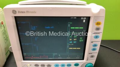 2 x GE Datex-Ohmeda F-FM-00 Patient Monitor *Mfd 2007* with 1 x GE E-PSMP-00 Module *Mfd 2011* and 1 x GE E-PSMPW Module *2012*(Both Power Up with some Casing Damage - See Photos) *6100054 - 6734199* - 2