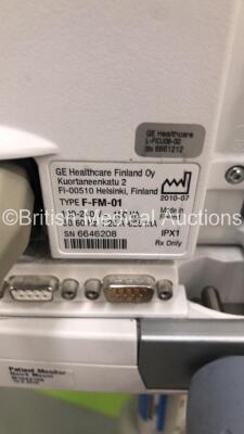 2 x GE S5 F-FM-01 Patient Monitors on Stands with 1 x N-FC-00 Module with Mini D-Fend Water Trap * Mfd 2010 * (1 x Powers Up,1 x No Power) * SN 6660422 / 6882589 * * Mfd 2012 / 2010 * - 5