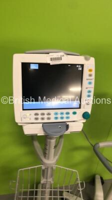 3 x GE S5 F-FM-00 Patient Monitors on Stands (All Power Up-All Chips to Casing-See Photos) * SN 6577677 / 6577659 / 6577666 * * Mfd 2009 / 2009 / 2009 * - 4