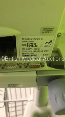 3 x GE S5 F-FM-00 Patient Monitors on Stands (All Power Up-All Chips to Casing-See Photos) * SN 6577677 / 6577659 / 6577666 * * Mfd 2009 / 2009 / 2009 * - 9