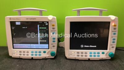 2 x GE Datex Ohmeda Type F-FM-00 Patient Monitors with 1 x GE E-PSMP-00 Modules ECG, NIBP, P1, P2, T1,T2 and SpO2 Options, 1 x GE E-PSM-00 Module Including ECG, NIBP, T1, T2 and SPO2 Options (Both Power Up with Cracked Casing, 1 with Faulty Screen- See Ph