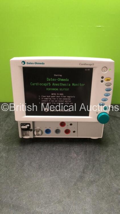 Datex Ohmeda Cardiocap 5 Anesthesia Monitor Including Spirometry, ECG, NIBP, SpO2, P1, P2, T1, T2 and Gas Options with D-fend Water Trap (Powers Up with Slight Damage on Casing-See Photo) *SNFBWF02338*