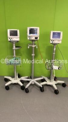 3 x Fukuda Denshi DS-7100 Patient Monitors on Stands with ECG/Resp, SPO2, NIBP, BP and Temp Options (All Power Up - 1 x Missing Printer Cover and All Units have Damage - See Pictures)