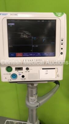 3 x Fukuda Denshi DS-7100 Patient Monitors on Stands with ECG/Resp, SPO2, NIBP, BP and Temp Options (All Power Up - 1 x Missing Printer Cover and All Units have Damage - See Pictures) - 3