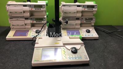 3 x Fresenius Vial Orchestra Base Units with 4 x Fresenius Vial Model MVP+ MS Infusion Pumps (All Power Up) *SN 19836118, 19836119, 20014339, 19836121, 20014341, 20014338*